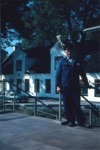 Christian Skdt taget ved Laurbjerg Station, med den hvidkalkede Bsbro Kro i baggrunden. Foto taget som lysbillede i 1960erne.